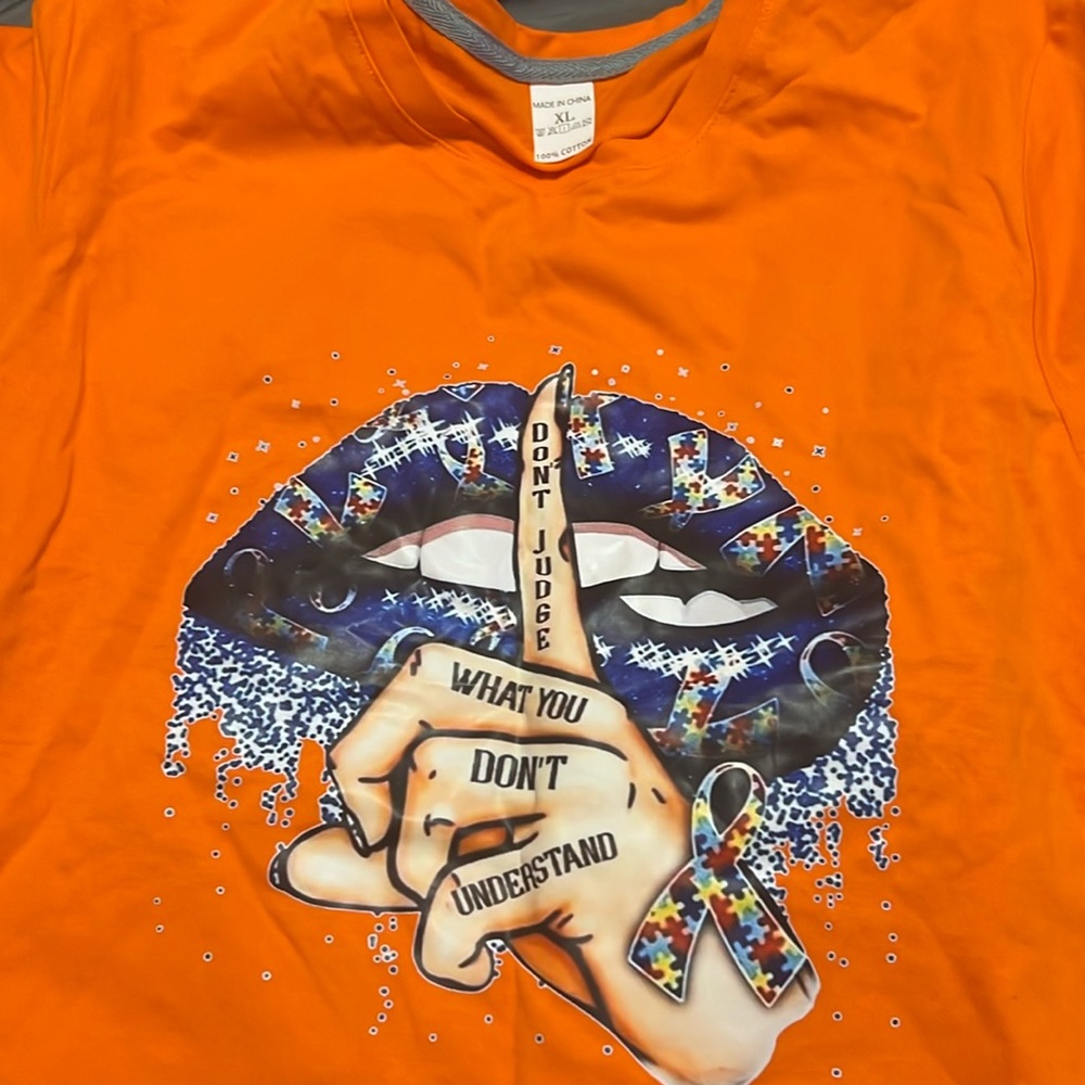 Orange woman t shirt no tags but never been worn.